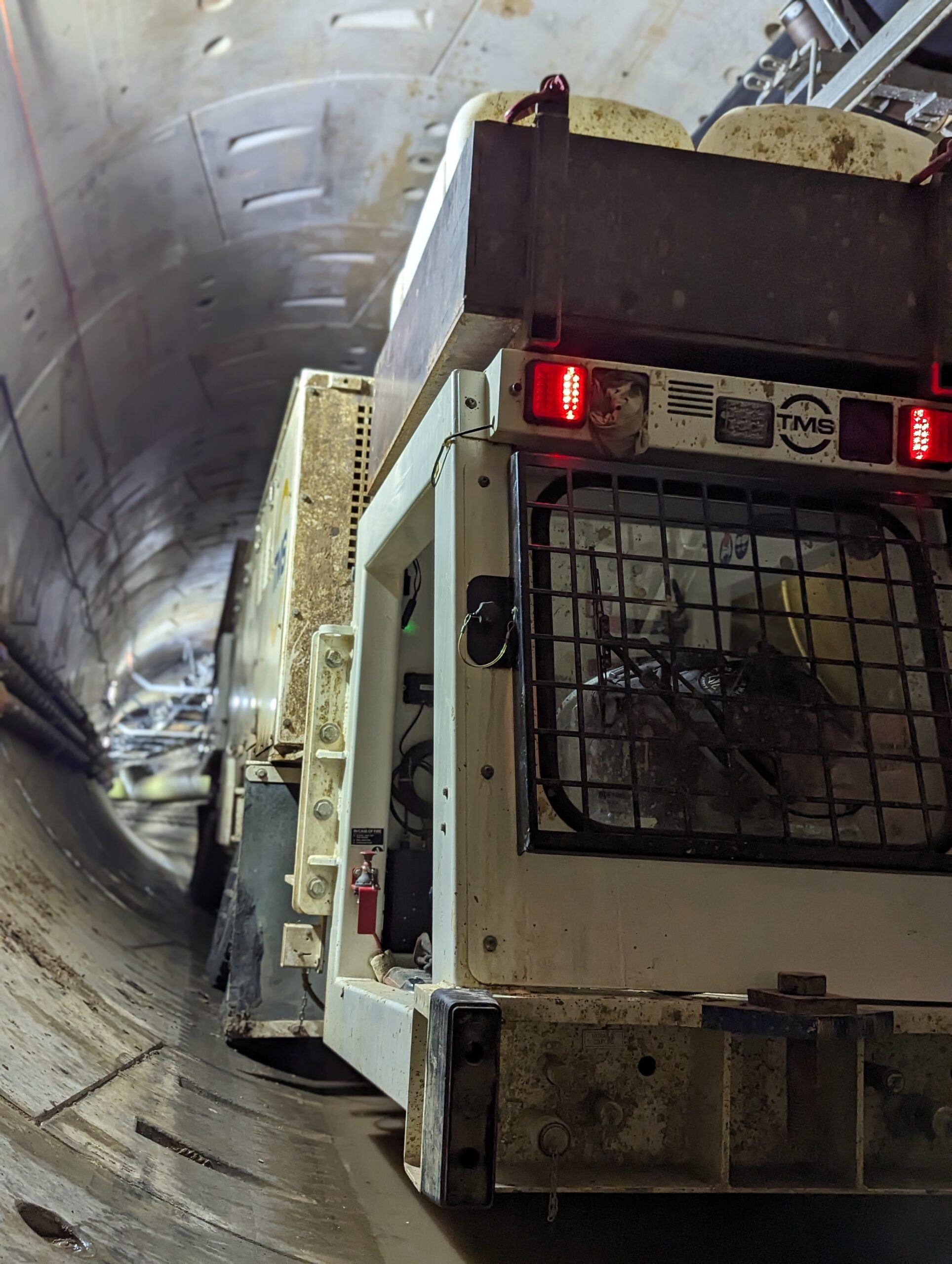 Machine working in a large underground tunnel