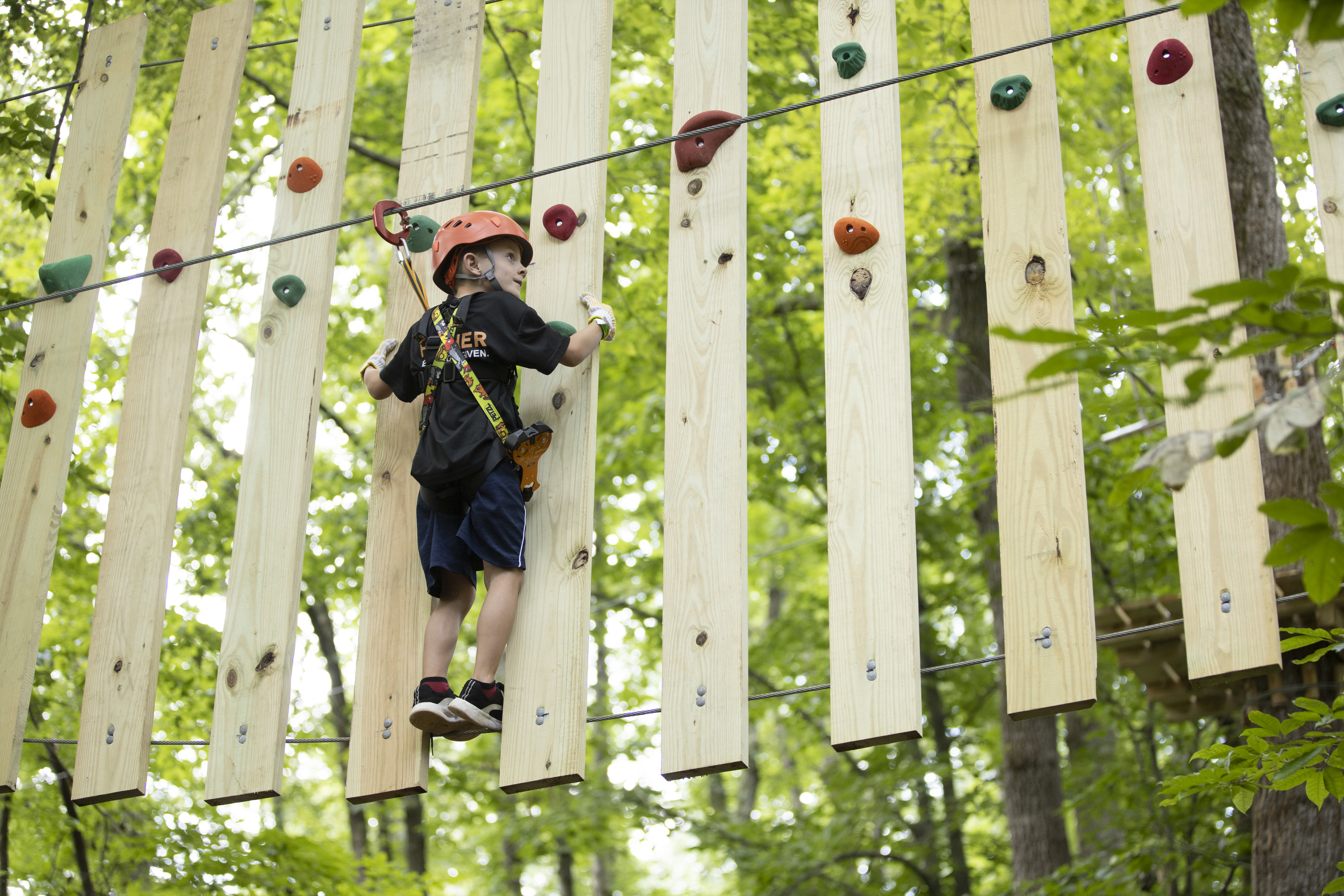 Kid moving along Roanoke county ropes course
